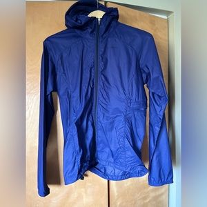 Patagonia brand Houdini jacket. Packs into itself for easy portability.